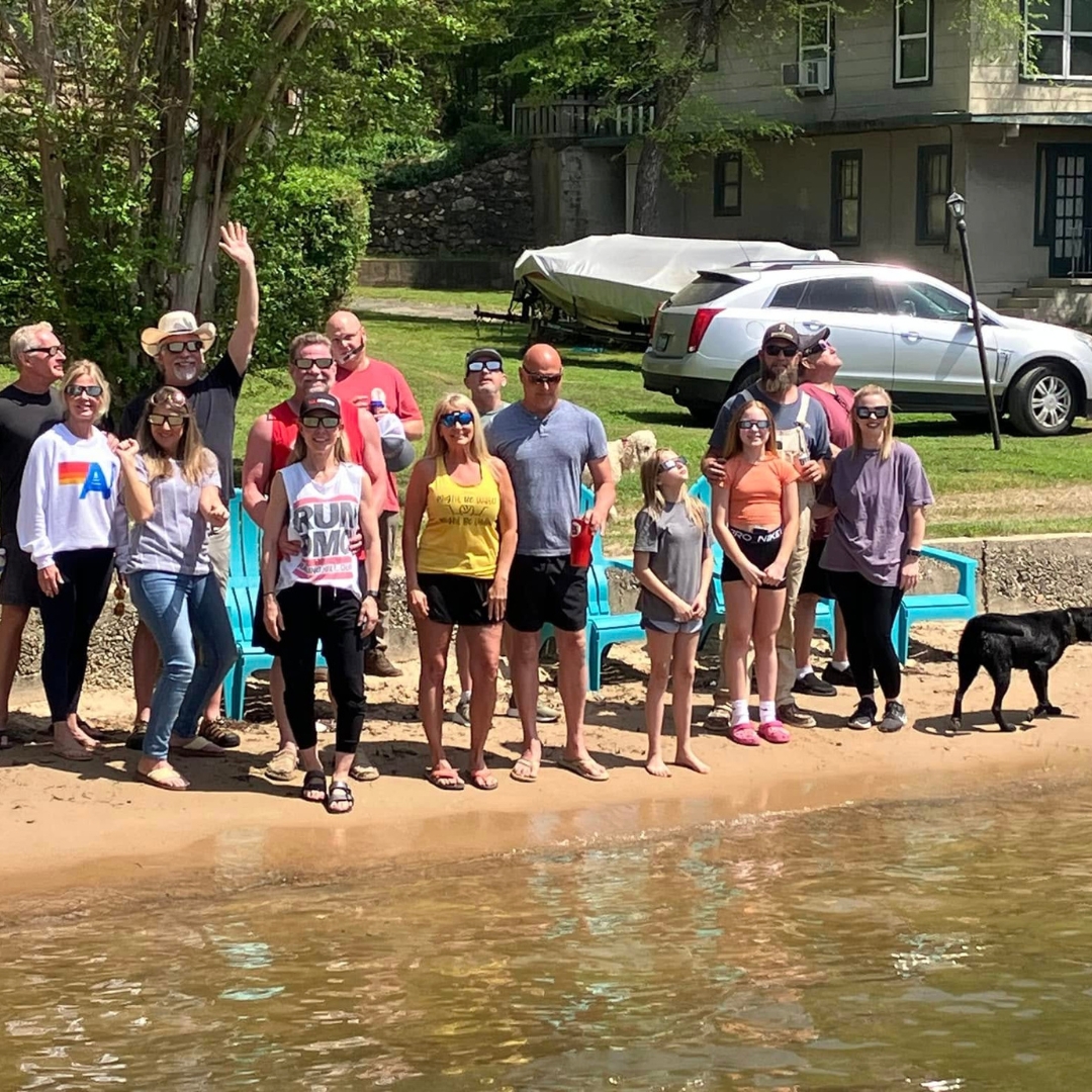 the whole family on the beach at Knollwood Lodge Lakefront cabin rentals