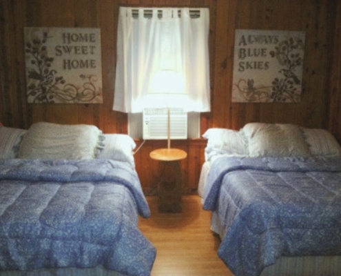 Cozy guest room with two full beds – Cabin 2 lakefront cabin in Hot Springs AR