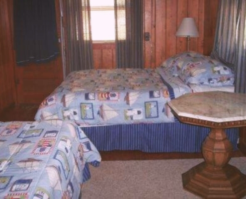 Bedroom with two full-size beds in Cabin 4 – cozy cabin in Hot Springs AR