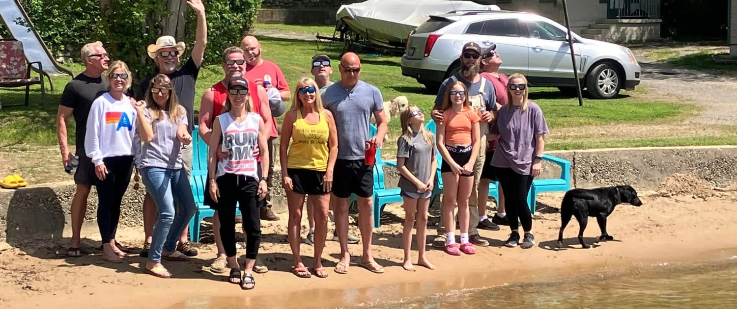 the whole family on the beach at Knollwood Lodge Lakefront cabin rentals
