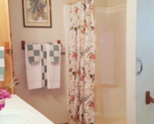 Bathroom with vanity, sink, and shower or tub.