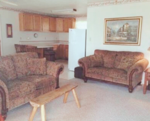 Living room seating area with comfortable couches.